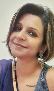 Woman wearing DRK Jewels blue tops